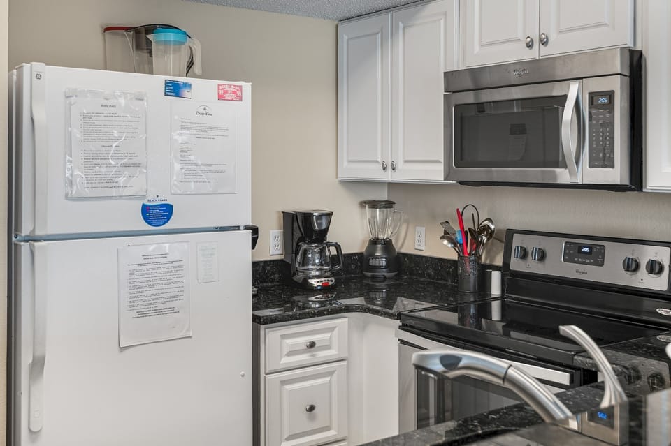 Granite counters and full appliances for cooking in.