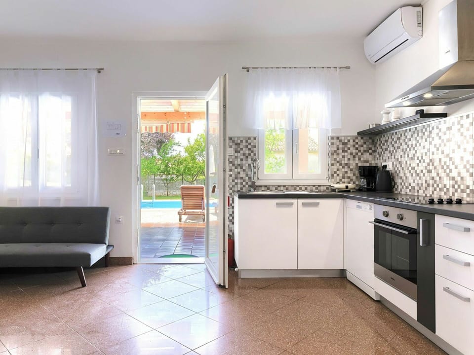 Building, Cabinetry, Furniture, Countertop, Kitchen Sink, Sink, Couch, Window, Kitchen Stove, Kitchen Appliance