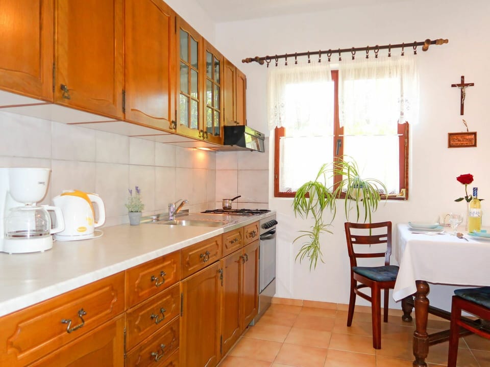 Countertop, Furniture, Room, Cabinetry, Kitchen, Property, Interior Design, Building, Tile, Floor