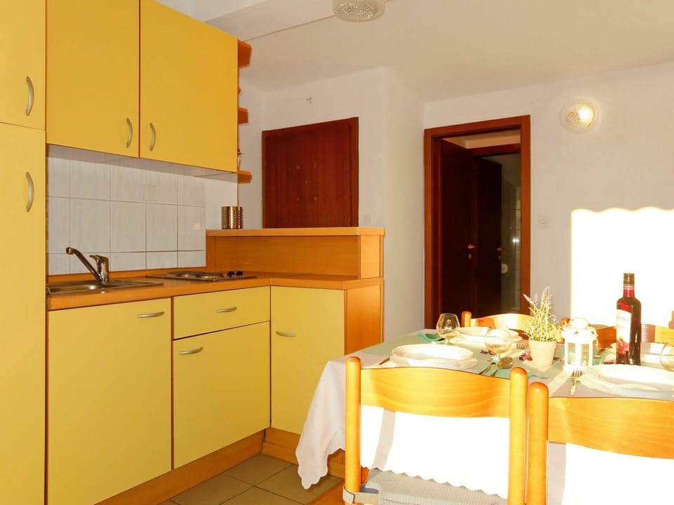 Room, Furniture, Kitchen, Cabinetry, Yellow, Property, Countertop, Interior Design, Orange, Building