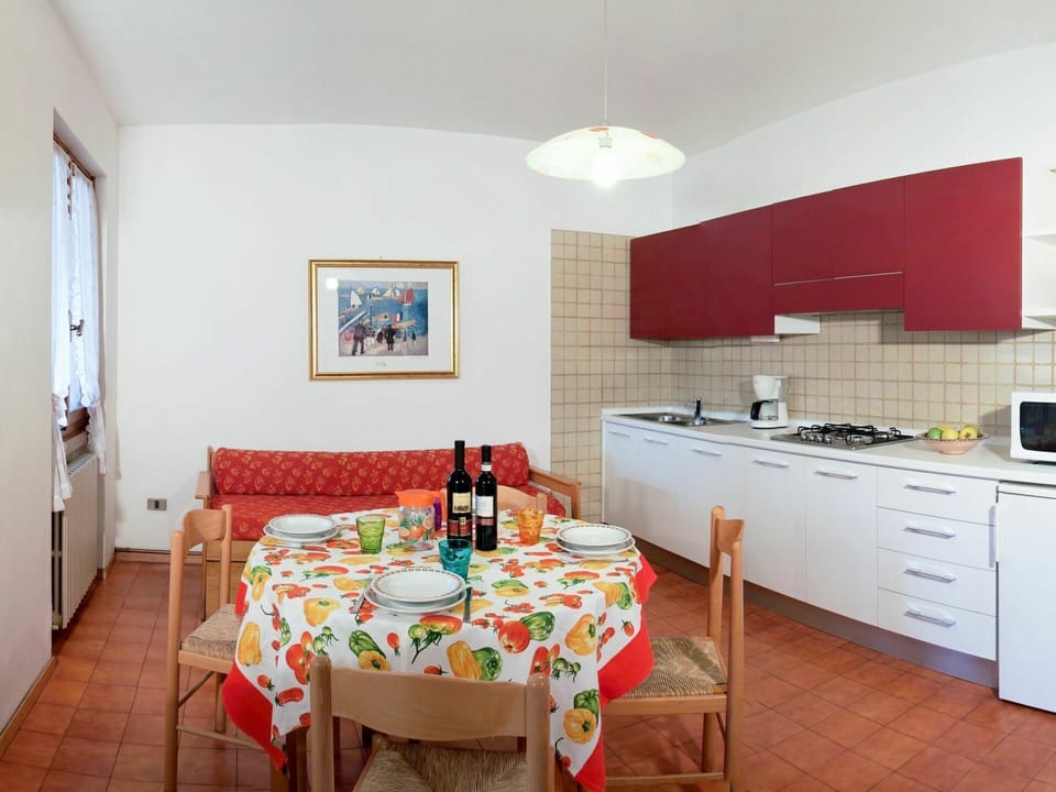 Furniture, Table, Cabinetry, Countertop, Building, Chair, Sink, Tap, Kitchen Stove, Tablecloth