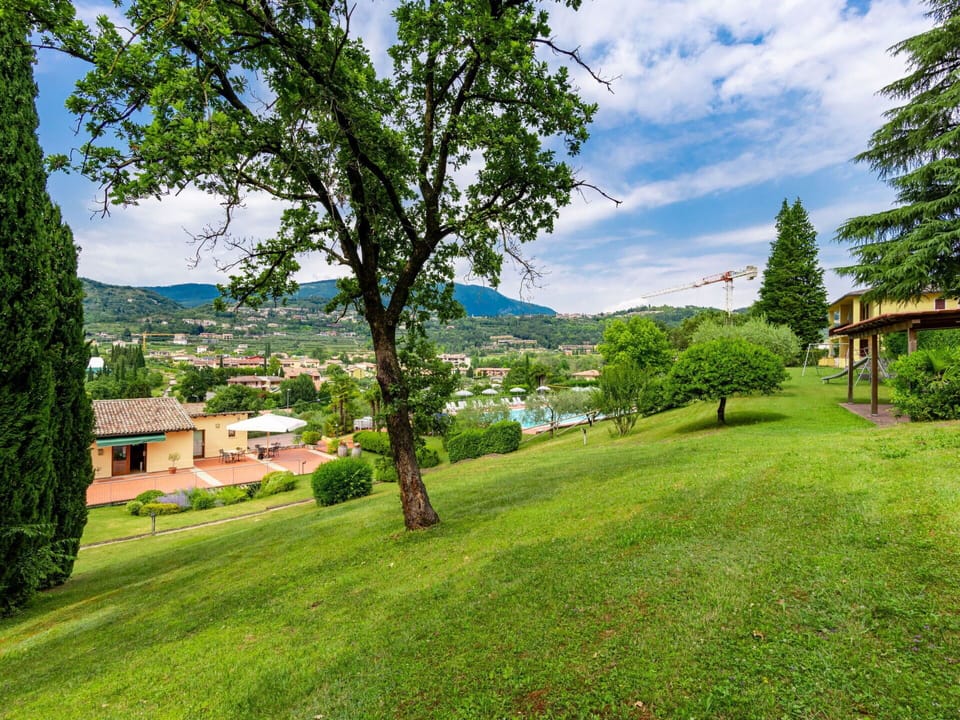 Plant, Sky, Cloud, Property, Green, Building, Natural Landscape, Tree, Land Lot, Vegetation