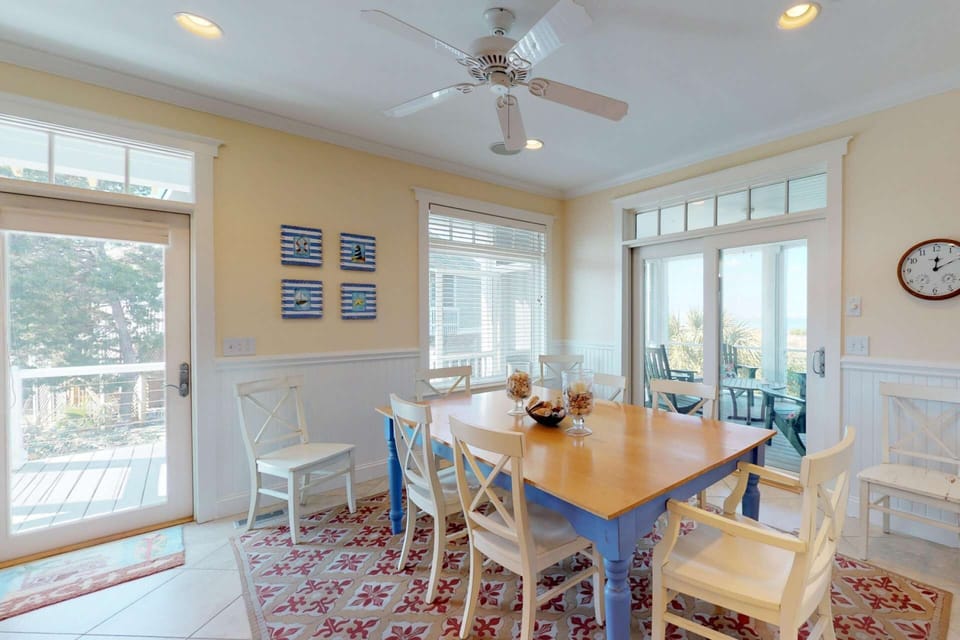 A large dining room table has enough seating for 8