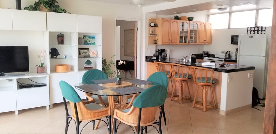 Kitchen, dining, and entertainment areas