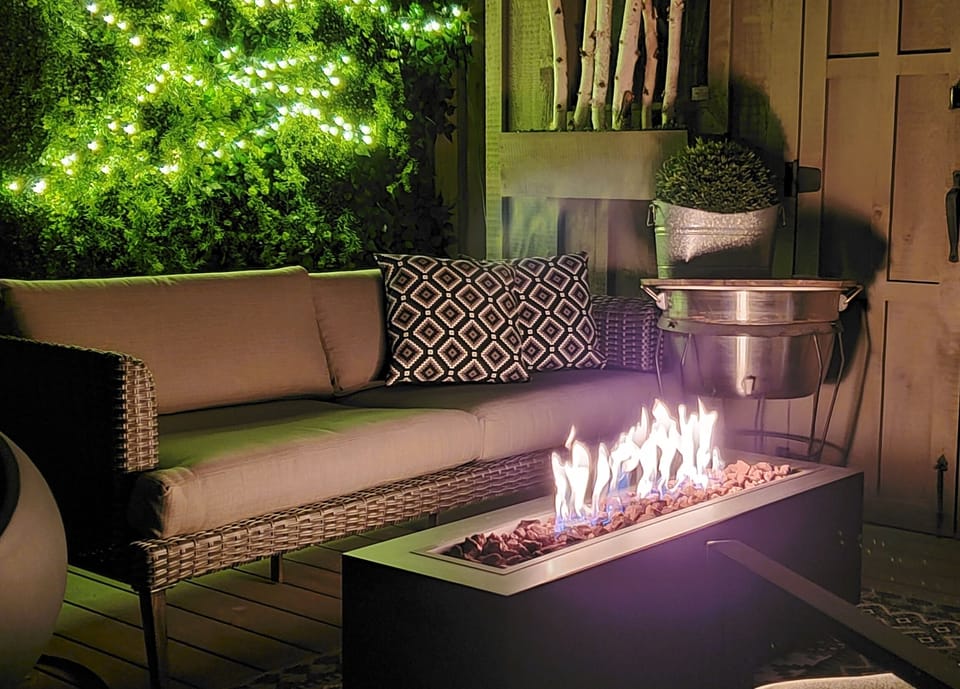 Back yard, covered lounge area with gas fire place.