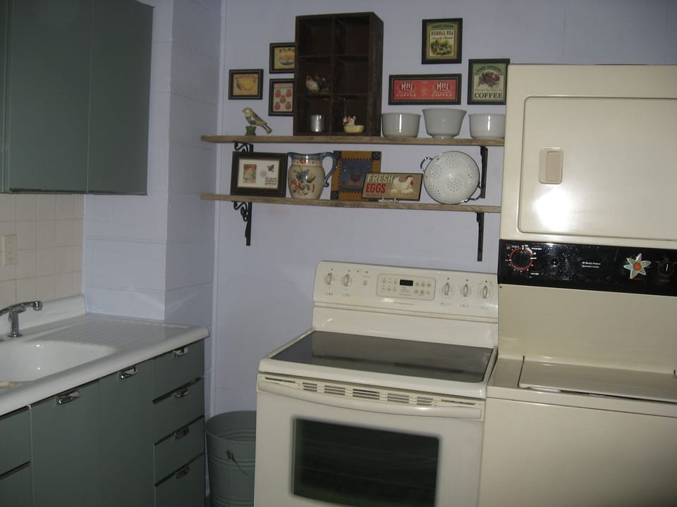 Kitchen with stacked washer/dryer