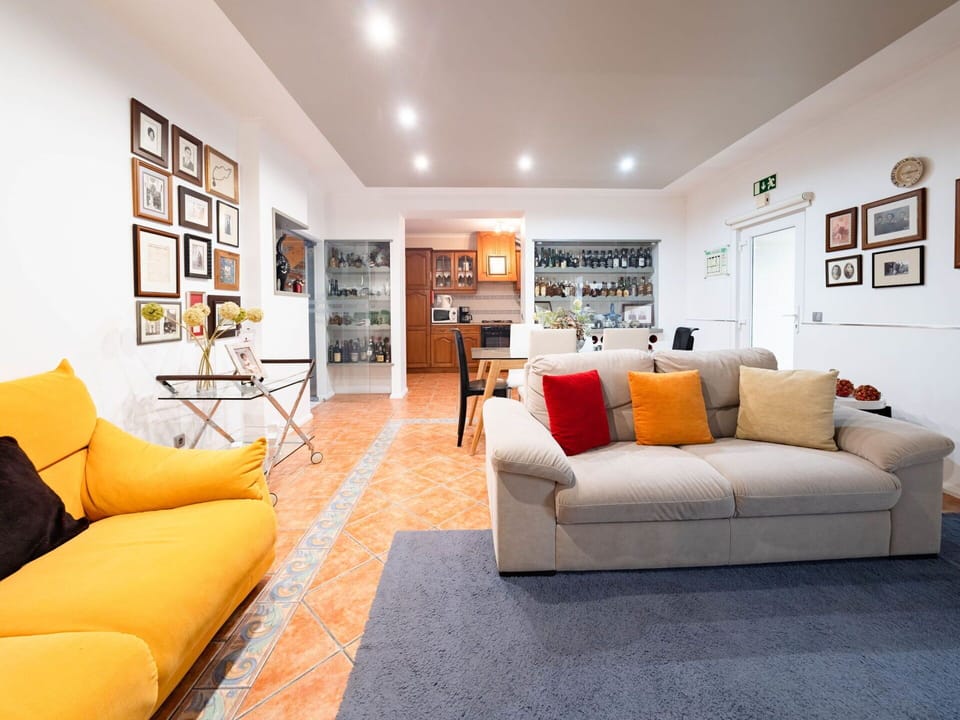 Couch, Picture Frame, Furniture, Property, Comfort, Orange, Interior Design, Floor, Living Room, Flooring