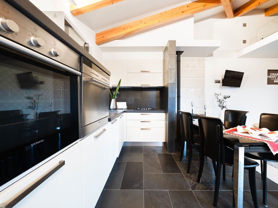 Property, Furniture, Countertop, Kitchen, Building, Interior Design, Television, Architecture, Wood, Floor