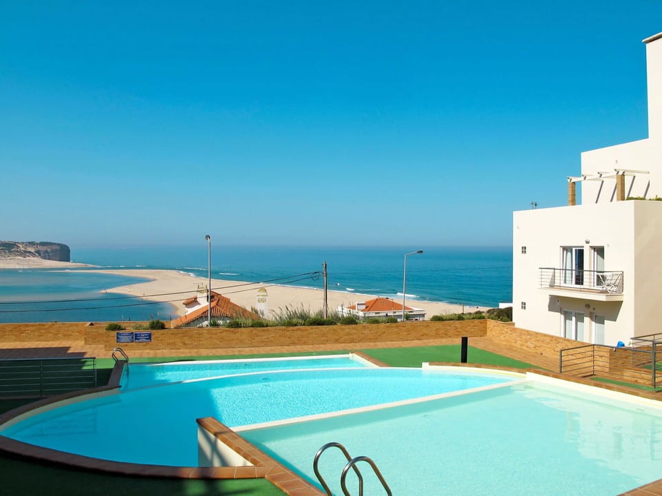 Water, Sky, Building, Property, Swimming Pool, Azure, Plant, Window, Seaside Resort, House