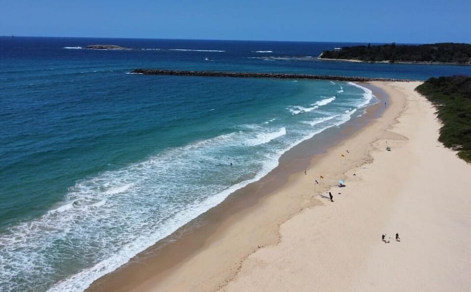 Blacksmiths Beach and breakwall
