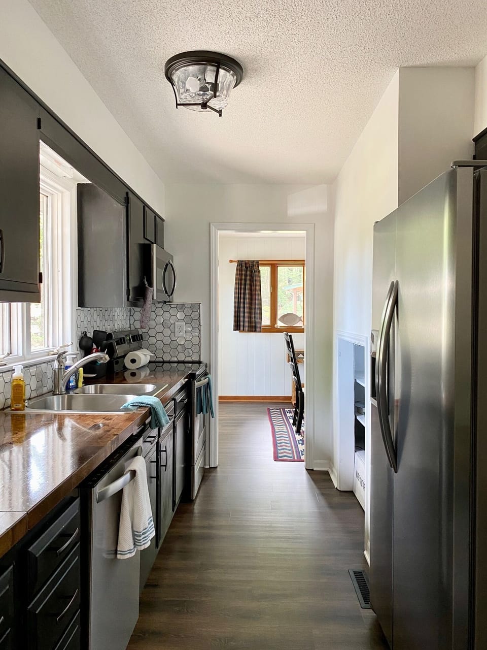 Newly upgraded kitchen with storage, dish washer and large refrigerator.