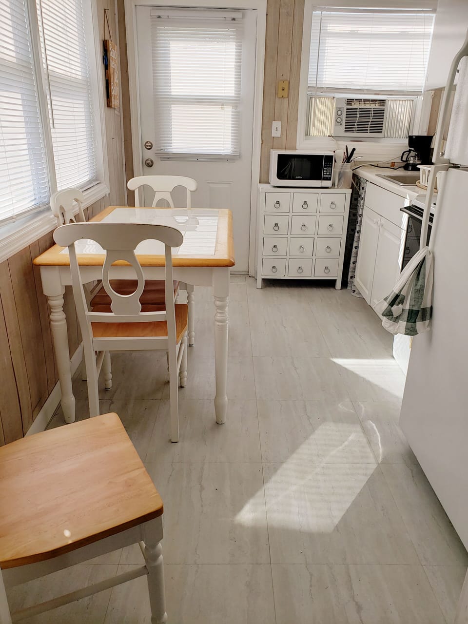 Kitchen with Stove/oven, microwave and refrigerator.