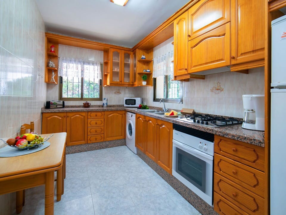 Cabinetry, Property, Countertop, Kitchen, Kitchen Stove, Kitchen Appliance, Window, Drawer, Orange, Wood