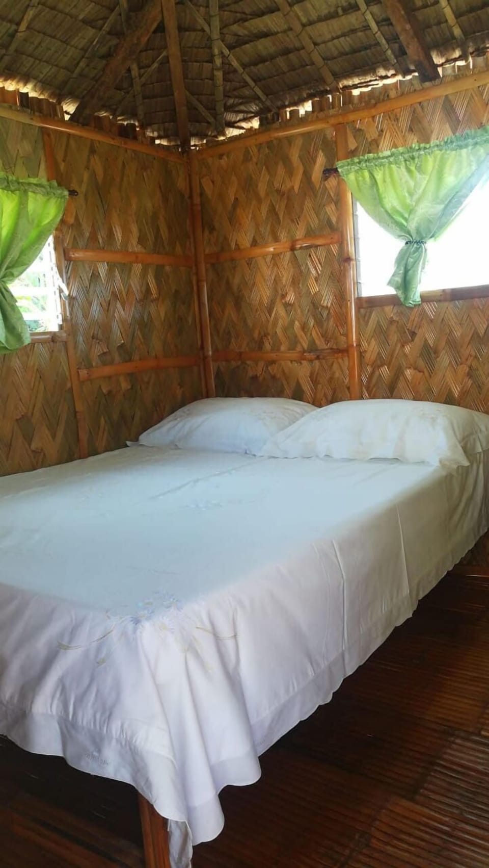 Bahay Kubo double bed with table, light, curtains, power sockets.