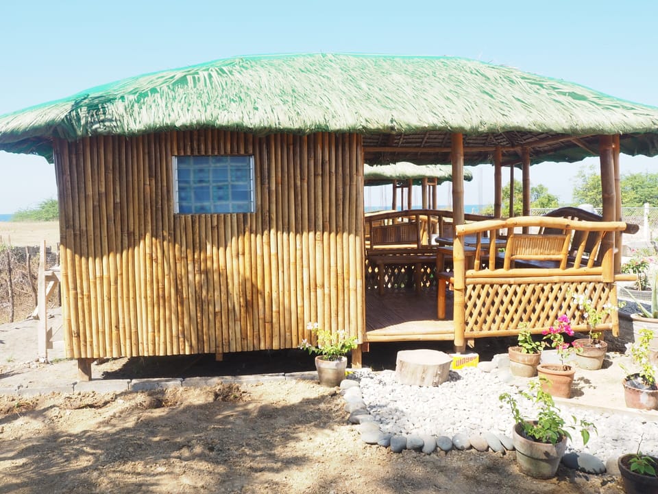 A bahay kubo is a traditionally built cottage made with bamboo and leaves.