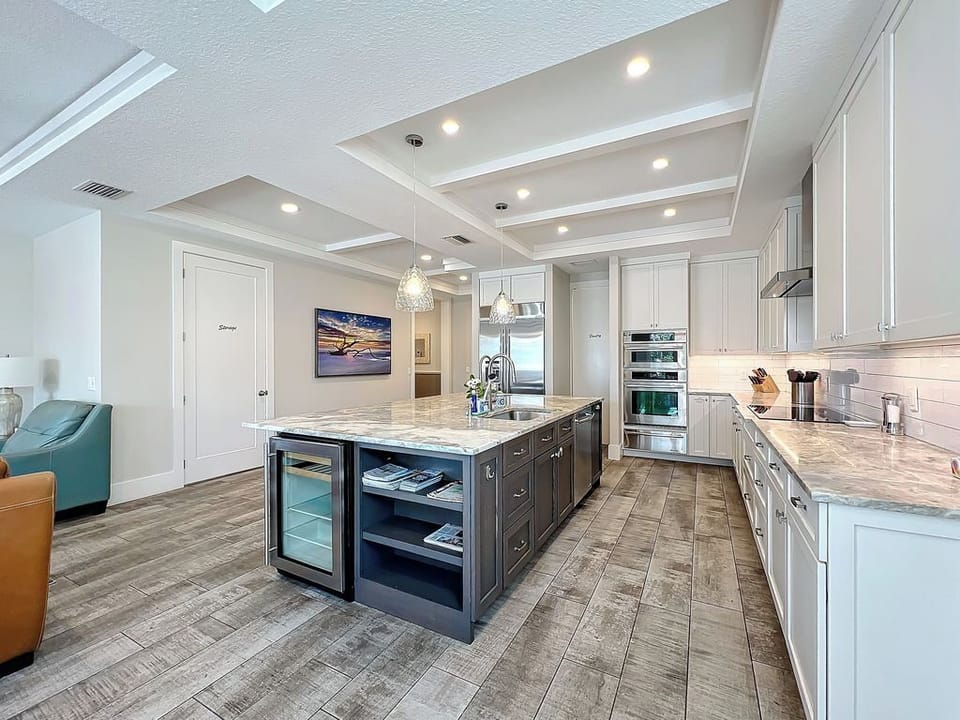 Large kitchen island with extra room for your drinks in the beverage cooler