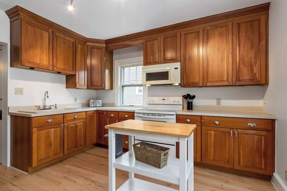 The kitchen is completely stocked with brand new dishes, pots, pans, and all the gadgets you need to make a great meal.