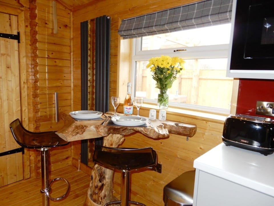 Raised dining table with view of pond & hot tub