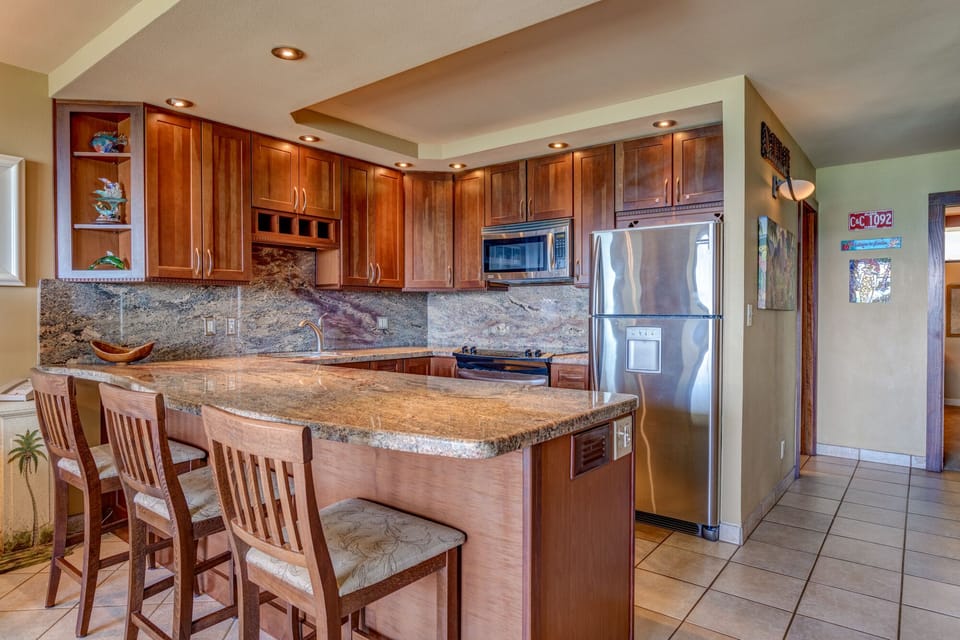 Upgraded kitchen with granite counter tops and back-splash