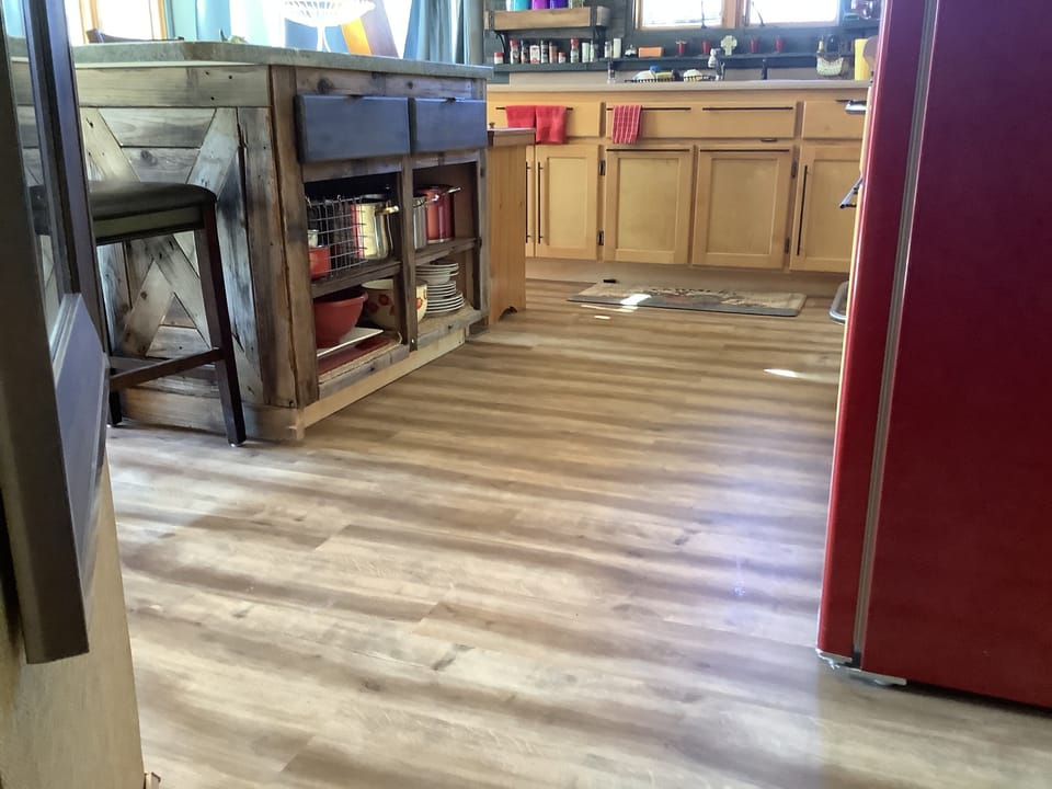Modern island and new floors throughout the cabin.