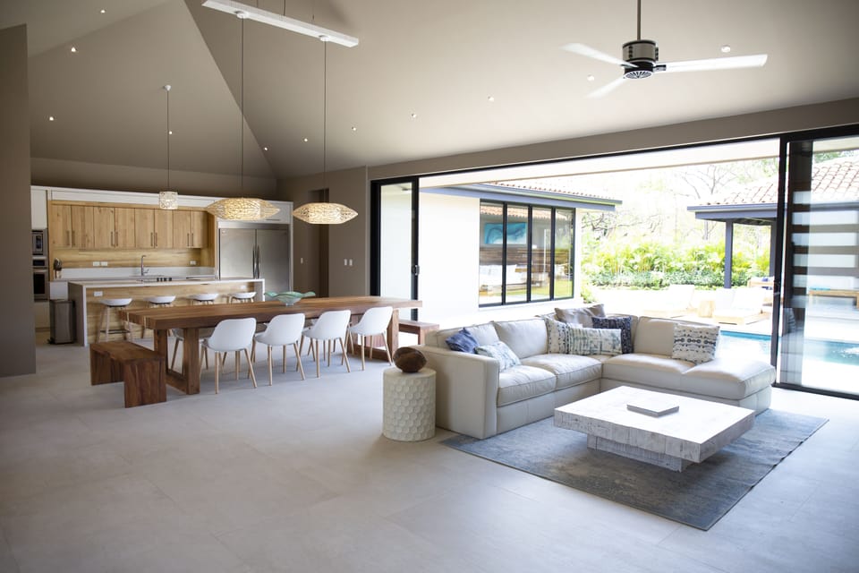 Open living and dining with indoor / outdoor design
