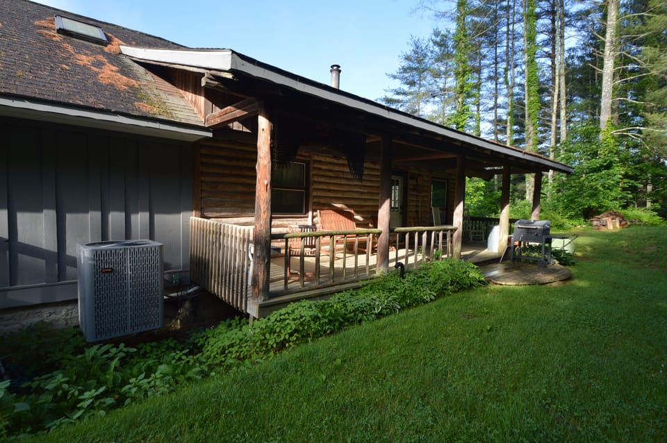 Porch with seating area and charcoal grill (May 2024)