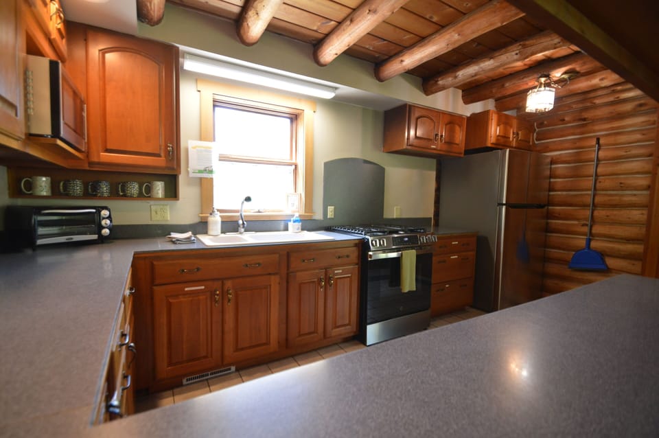 Kitchen with new stove (May 2026) and plentiful counter space.
