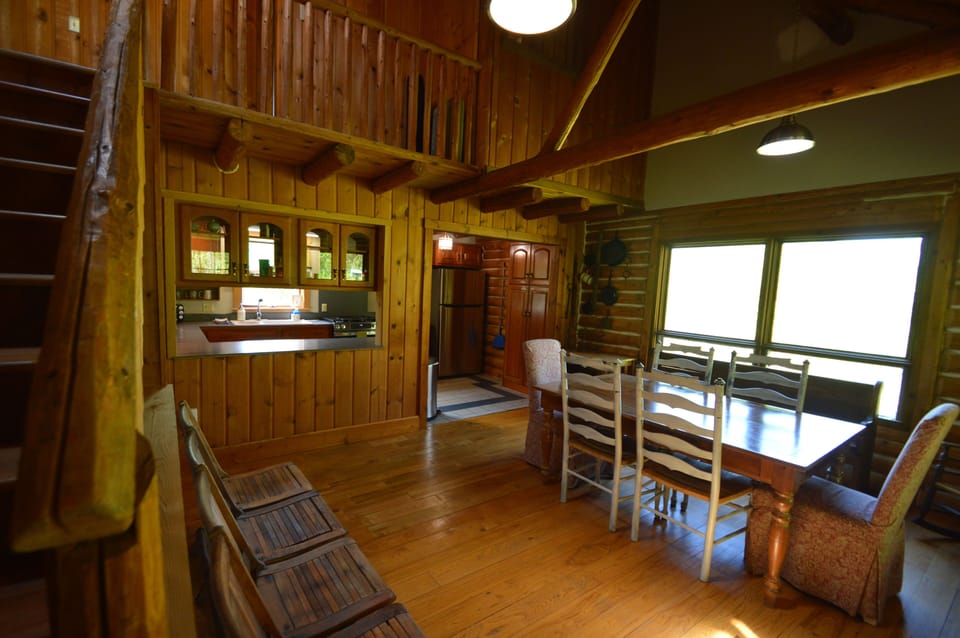 Dining room view open to kitchen from the porch.