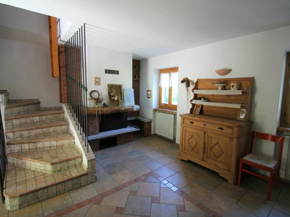 Furniture, Cabinetry, Picture Frame, Wood, Houseplant, Drawer, Living Room, Floor, Flooring, Wood Stain