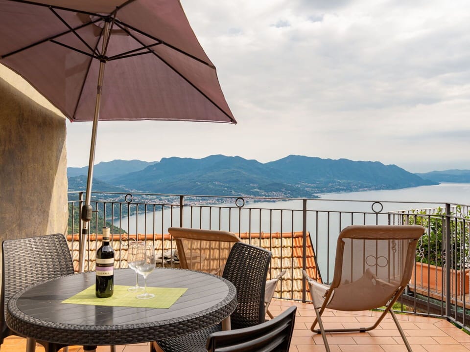 Sky, Furniture, Water, Table, Cloud, Building, Umbrella, Chair, Wood, Outdoor Furniture