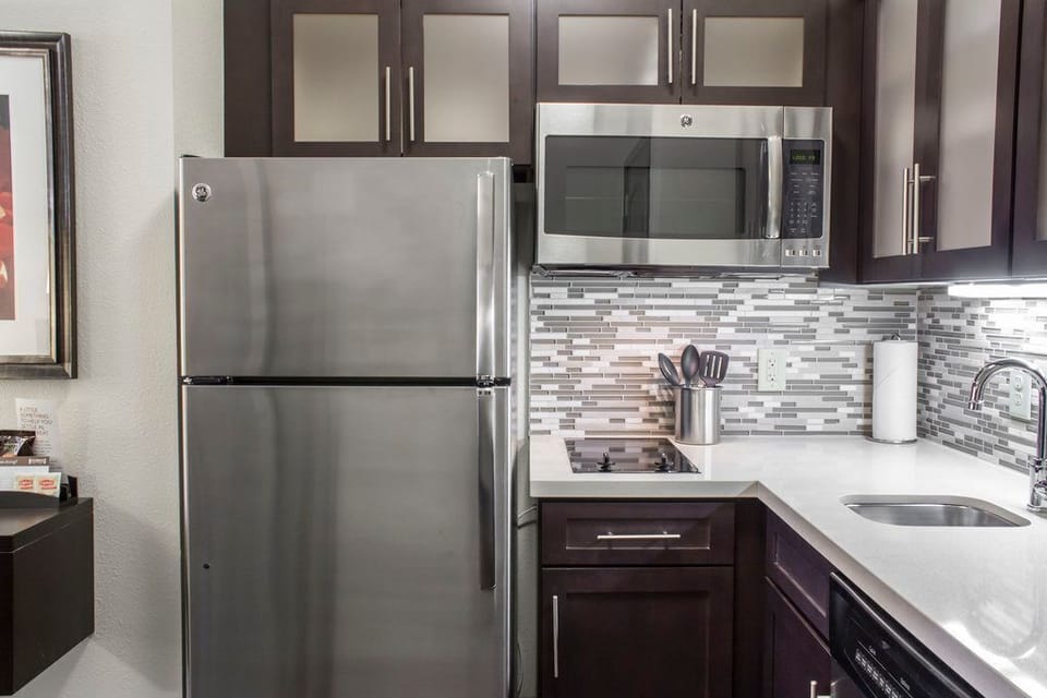 Enjoy the convenience of a well-equipped kitchen, featuring modern appliances and sleek cabinetry for all your cooking needs.