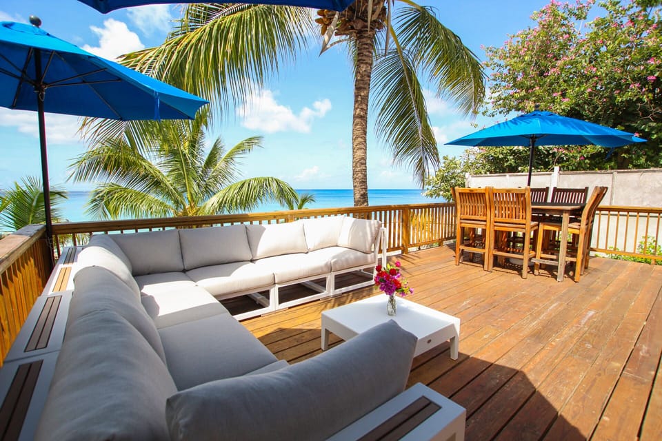 The spacious deck  - both covered by umbrellas