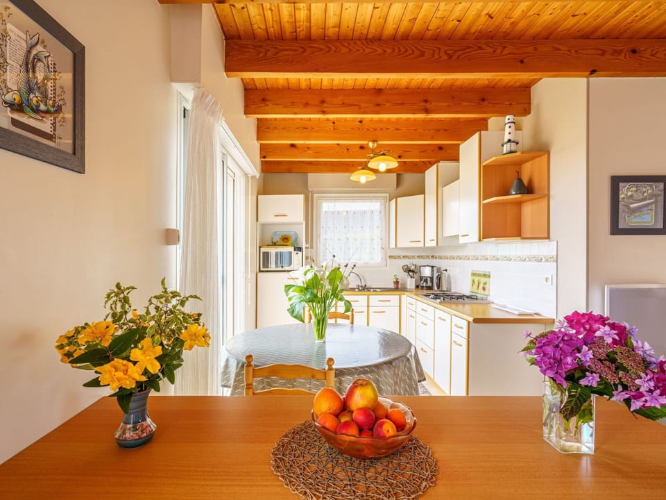 Table, Flower, Plant, Furniture, Property, Cabinetry, Orange, Picture Frame, Wood, Interior Design