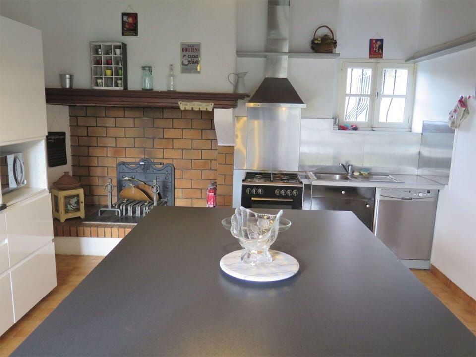 Furniture, Property, Cabinetry, Table, Countertop, Kitchen Stove, Kitchen Appliance, Wood, Kitchen, Home Appliance