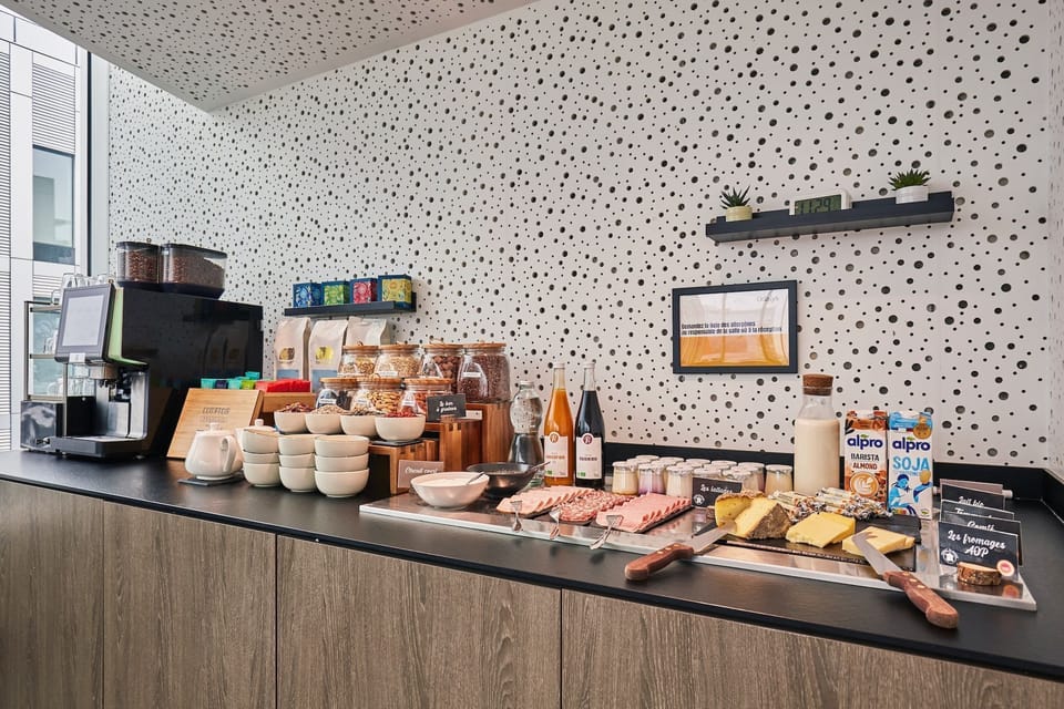 Tea and coffee station stocked with premium blends, pastries, and breakfast snacks.