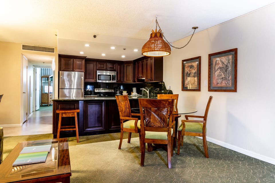 Relax in your spacious open-plan suite featuring a fully equipped kitchen, charming dining area, and elegant tropical touches that bring island comfort right to your doorstep.