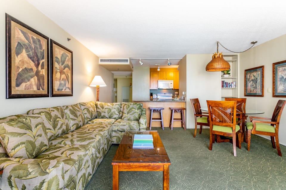 Settle into your tropical-inspired retreat with an open layout that flows from the living area to your fully equipped kitchen and dining space—perfect for relaxing after island adventures.