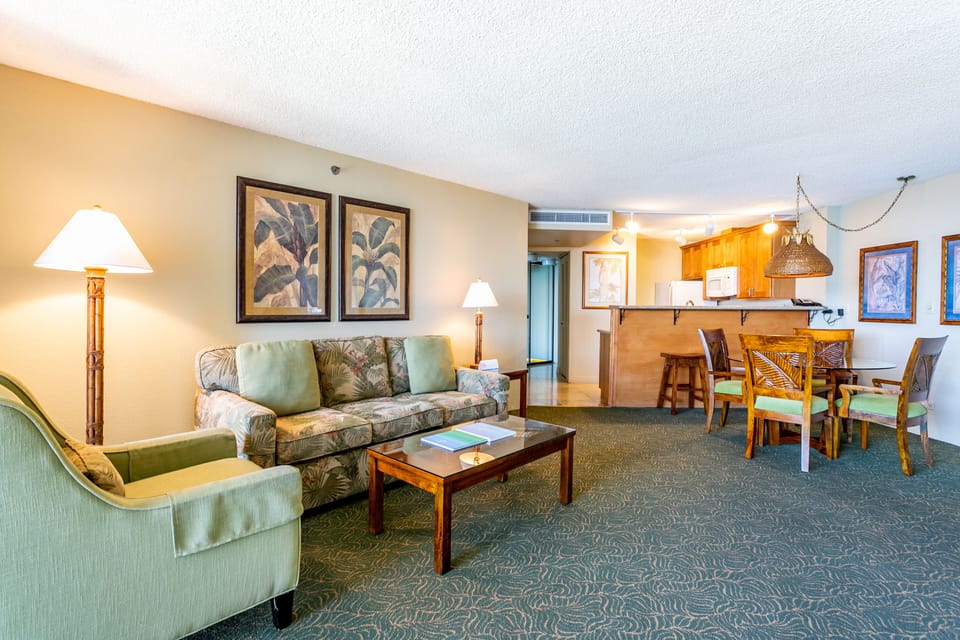 Your spacious retreat features a cozy living area with tropical-inspired décor, a fully equipped kitchen, and a welcoming dining space—perfect for unwinding after a day of adventure.