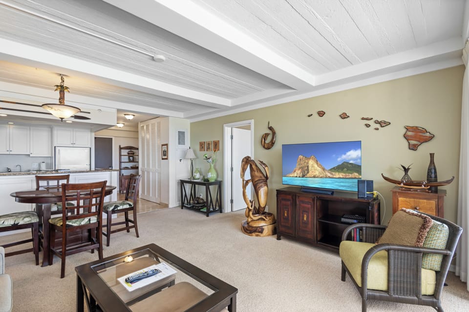 Relax in your open-concept living space with island-inspired decor, a fully equipped kitchen, and comfortable seating—perfect for unwinding after a day of adventure.
