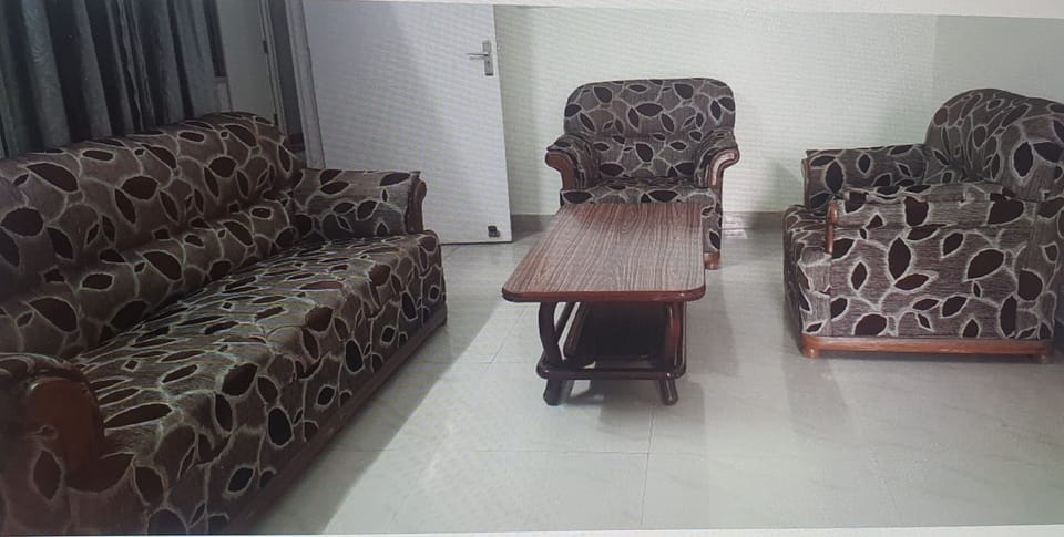 drawing room with 3+1+1seater sofa and center table.