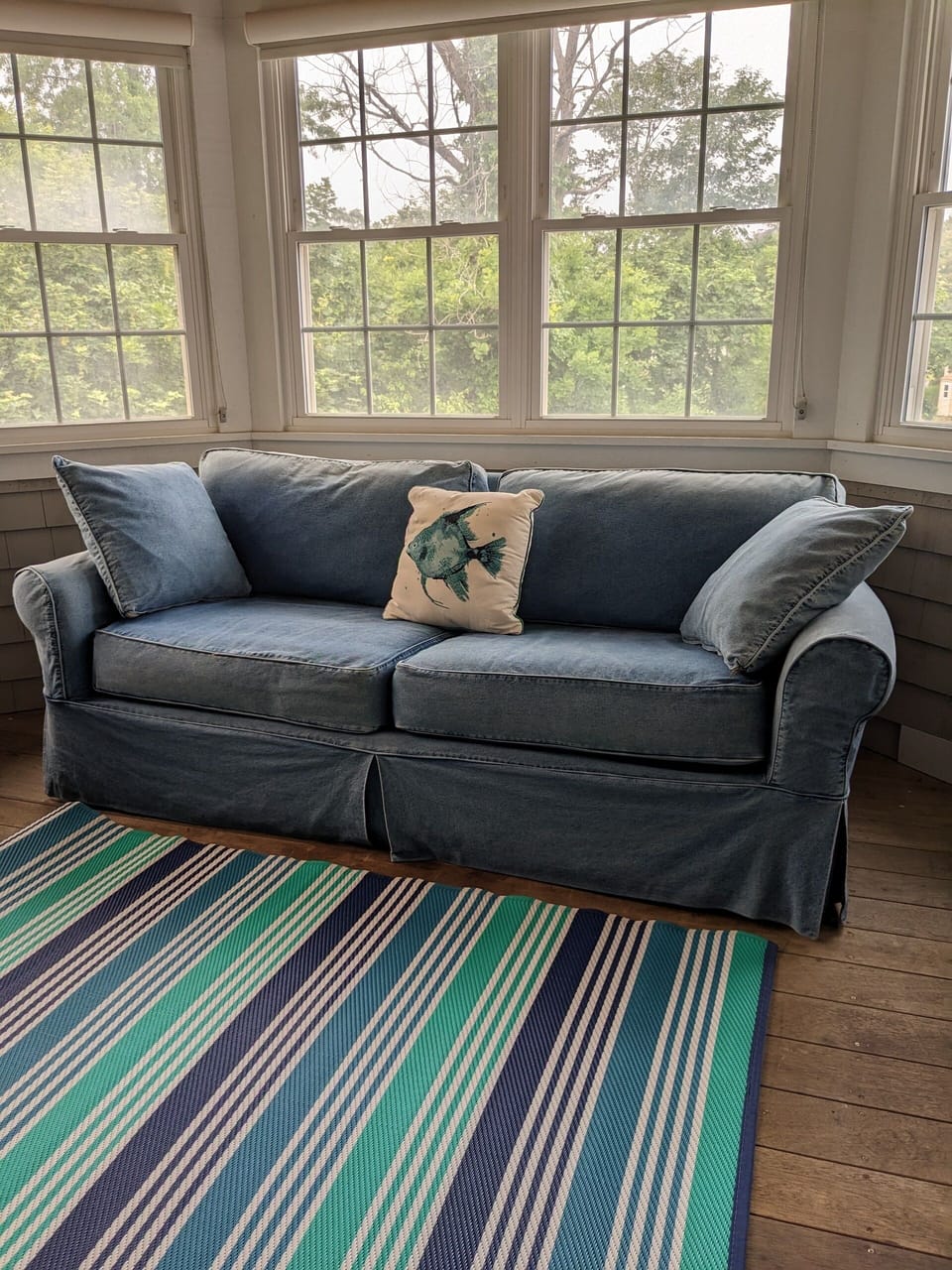 Queen sleeper sofa with TV on sleeping porch off second floor bedroom
