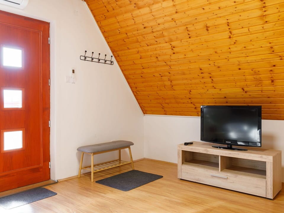 Furniture, Property, Comfort, Wood, Television, Lighting, Interior Design, Orange, Living Room, Floor