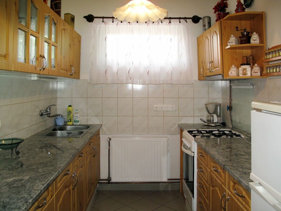 Kitchen Sink, Cabinetry, Sink, Countertop, Kitchen Stove, Tap, Wood, Interior Design, Lighting, Kitchen