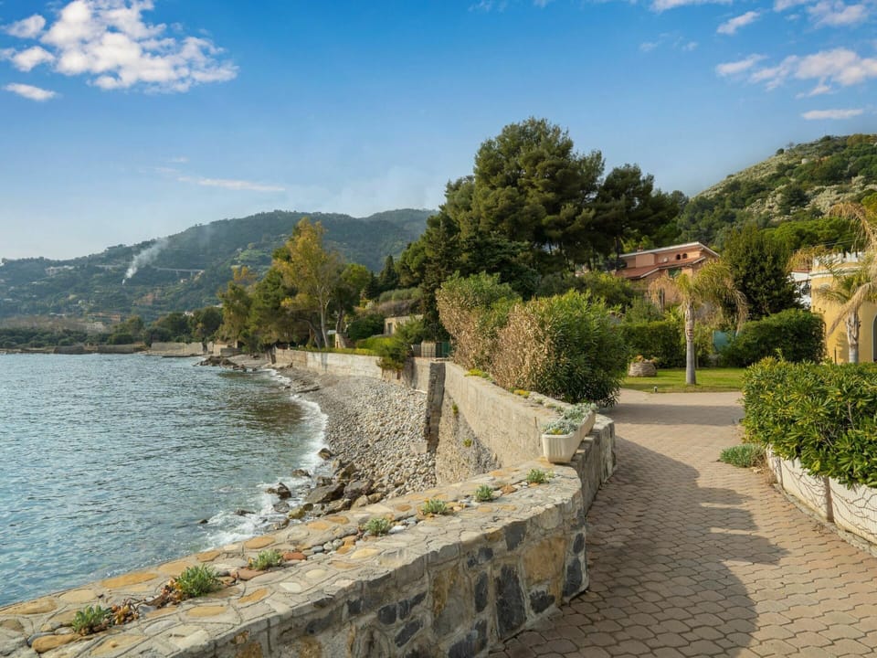 Cloud, Water, Sky, Plant, Mountain, Tree, Street Light, Lake, Coastal And Oceanic Landforms, Wall