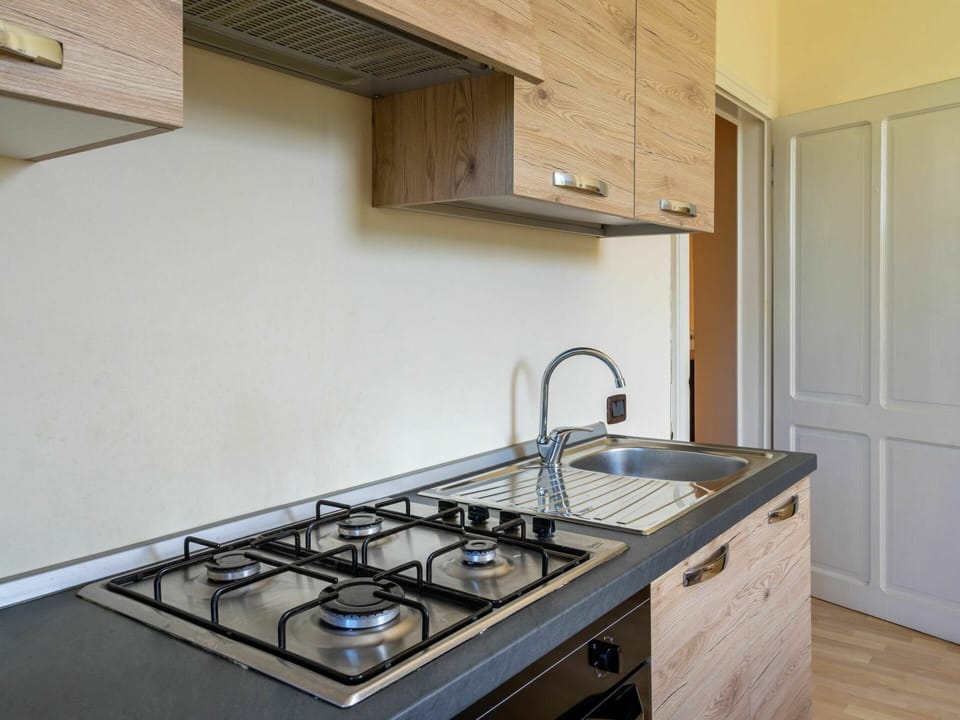 Property, Sink, Kitchen Sink, Room, Countertop, Kitchen, Gas Stove, Cooktop, Kitchen Stove, Cabinetry