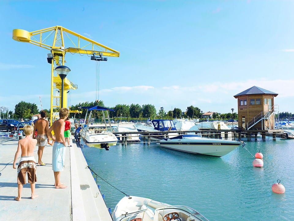 Sky, Water, Cloud, Boat, Watercraft, Building, Vehicle, Dock, Leisure