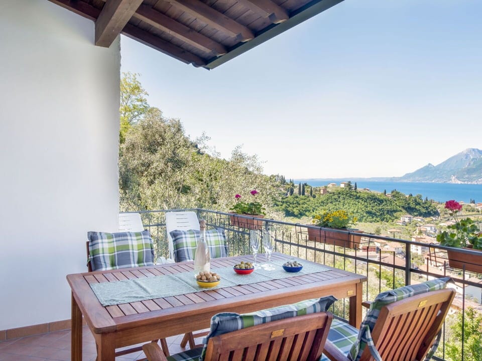 Sky, Table, Plant, Furniture, Building, Flowerpot, Chair, Azure, Seaside Resort, Porch