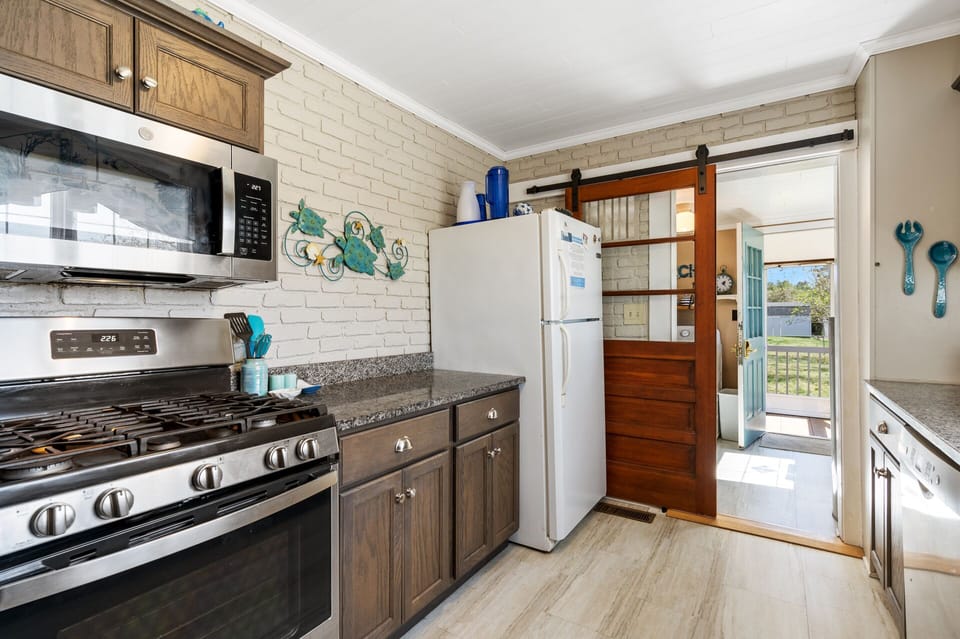 The stunning Newly Remodeled Kitchen is the perfect blend of Old World Charm & Modern Amenities.