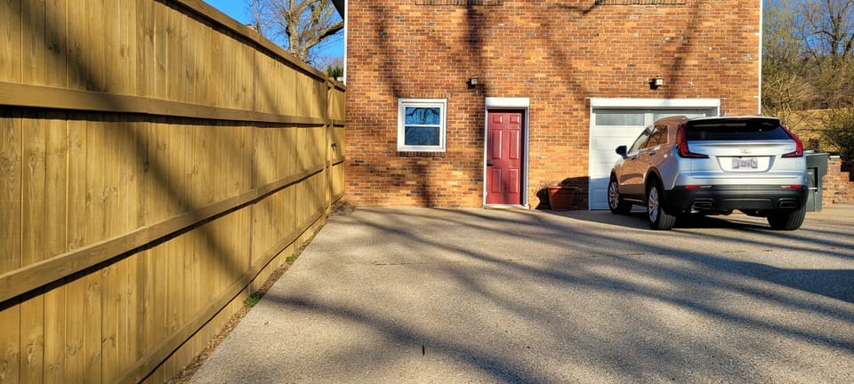 Entrance is the red door, it has key-less entry for convenience. Park in front.