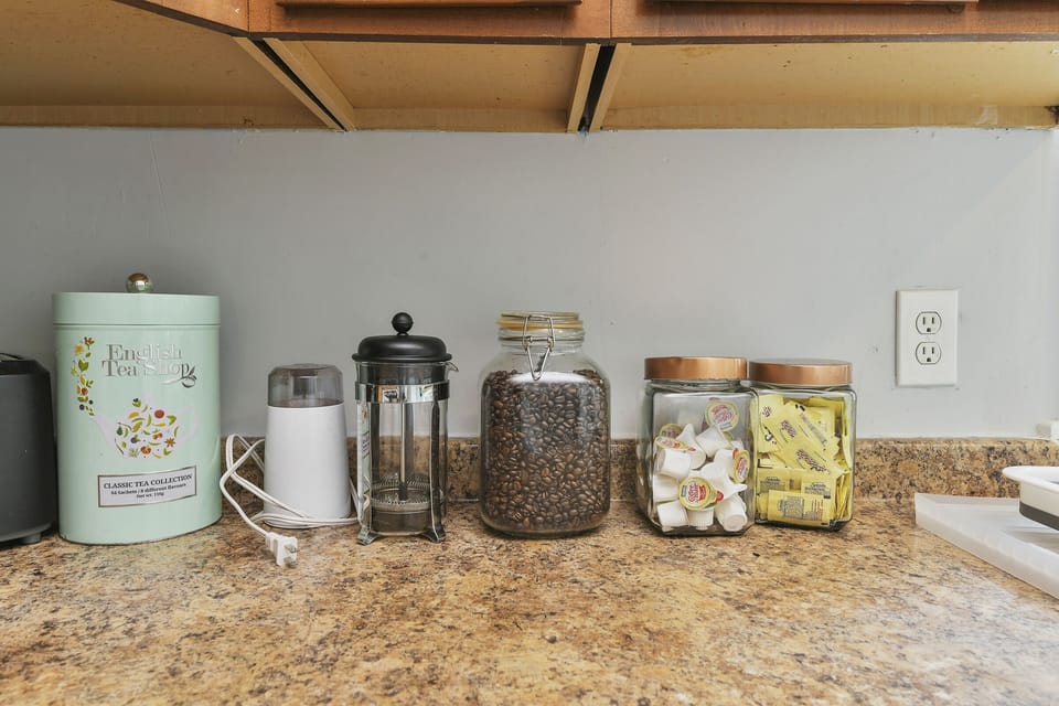 Complimentary tea, coffee beans, grinder, sugar and creamer for guests. 
